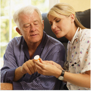 Caregiver assisting patient with medication